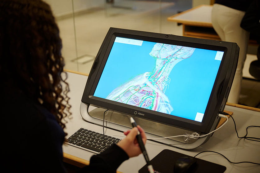 Student using electronic tablet and pen