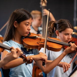 Girls playing violin