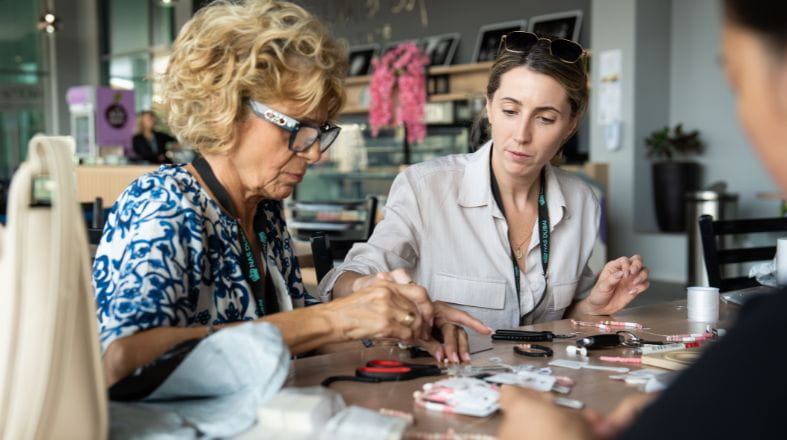 Parent Association at NAS Dubai making bracelets.