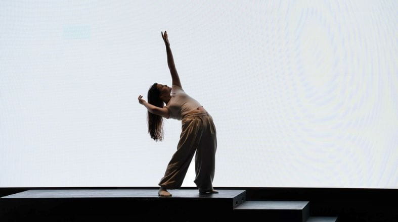 IB Student on stage performing solo exam