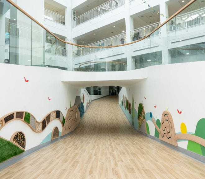 EYFS sensory walkway at NAS Dubai featuring interactive wall elements designed for early years learning and development.