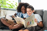 Primary children enjoying reading in the library.