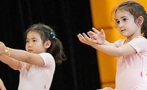 students performing ballet in the sports hall
