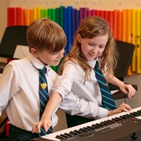 Juilliard Boy and Girl playing piano keyboard music lesson