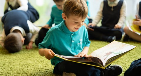 Primary Student Reading a Book