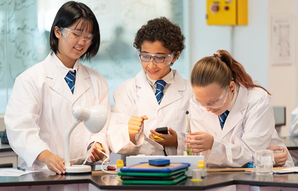 Secondary students work together in a science lab