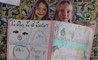Girls wrote and illustrated a story.