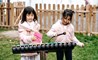 A truly international school primary students xylophone outside 