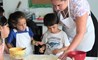 ICS Summer Camps Campamentos de Verano cooking class apron dough