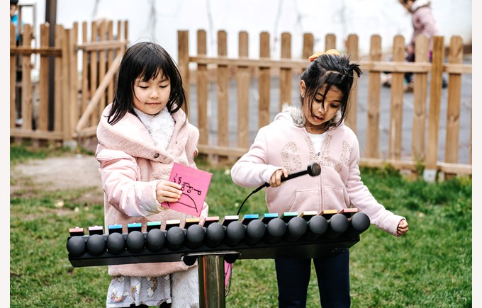 A truly international school primary students xylophone outside 