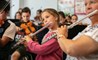 Orchestra practice student playing flute in school