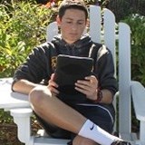 Boy reading on an iPad