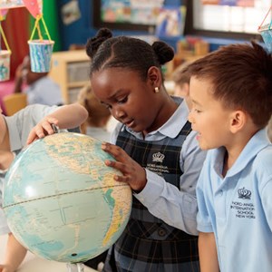 Children looking at globe
