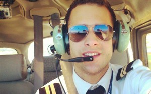 BISB alumni Everardo Ortiz is pictured in the cockpit of an airplane. He recently achieves his goal of becoming a pilot.
