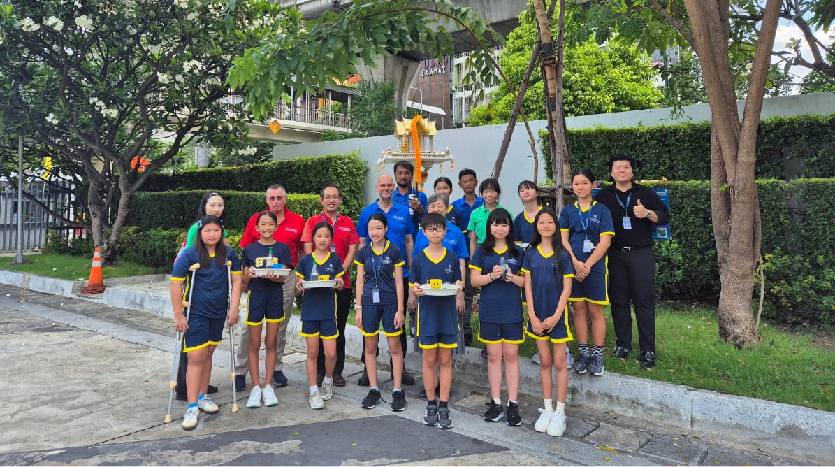 Year 7 First Language Japanese students join the Senior Leadership Team to plant new trees on campus - New trees across campus